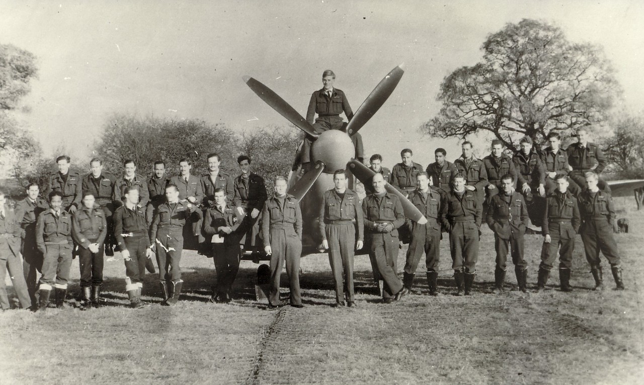 14-132-SqdnRAF-Detling-JJ-Caulton-front-row-5th-from-right.jpg