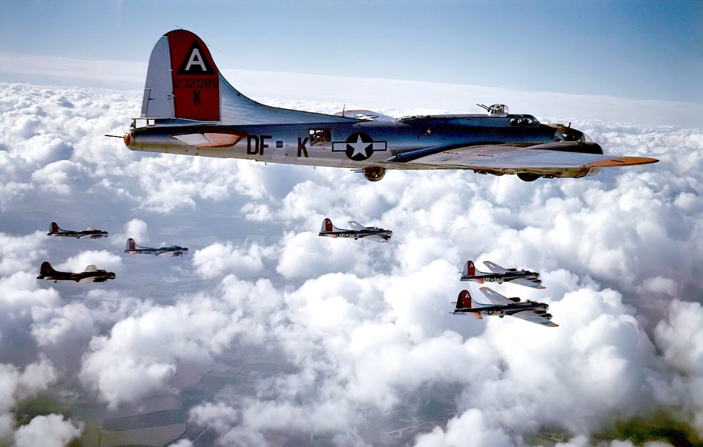 91st BG Ragged Irregulars, Bassingbourn, in formation over billowing white clouds. On Feb. 3 1...jpg