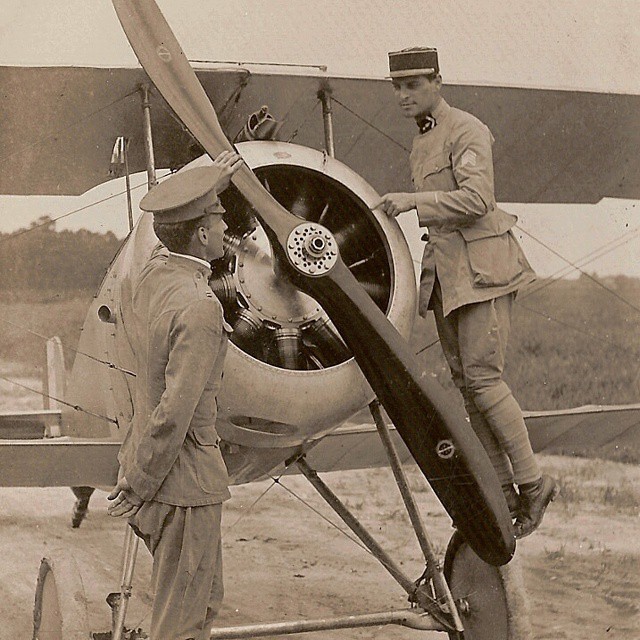 A French Lieutenant explains the mechanism of the Nieuport plane at Fort Monroe, Virginia, dur...jpg