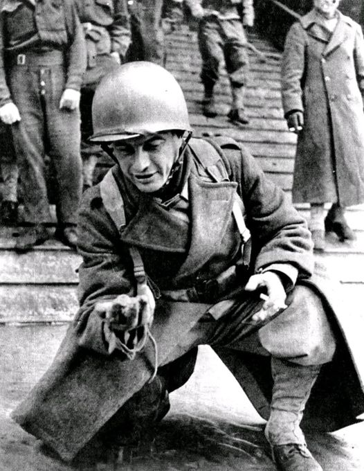 A soldier of General Leclerc's French 2nd Armoured Division savors the moment as he sets foot ...jpg