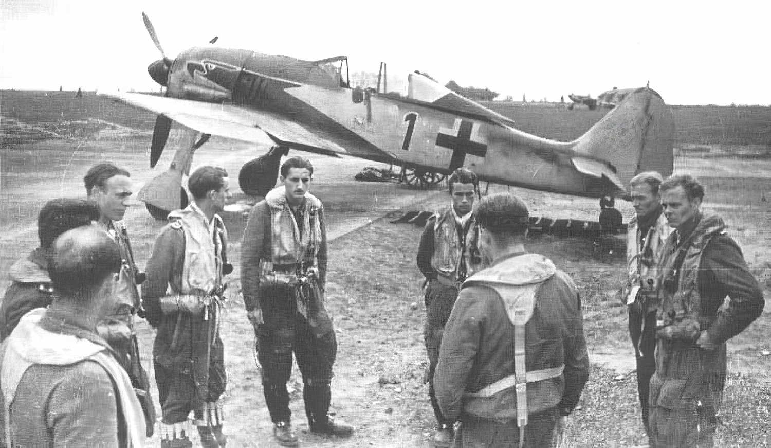 A Staffelfuehrer briefs his pilots in 1943, with a Focke Wulf Fw 190.jpg