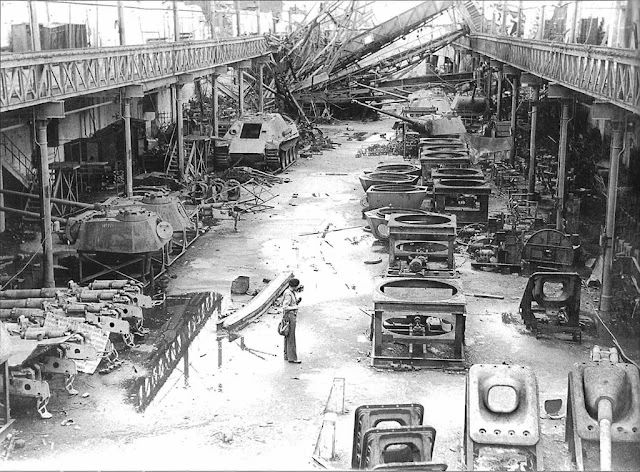 allied soldier standing in the ruins of MAN'S panther tank factory in Nuremberg, multiple unfi...jpg