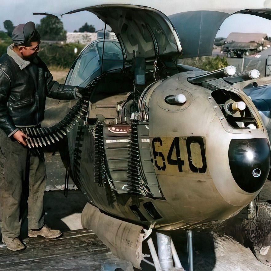 Armorers loading ammunition onto a Lockheed P-38 Lightning..jpg