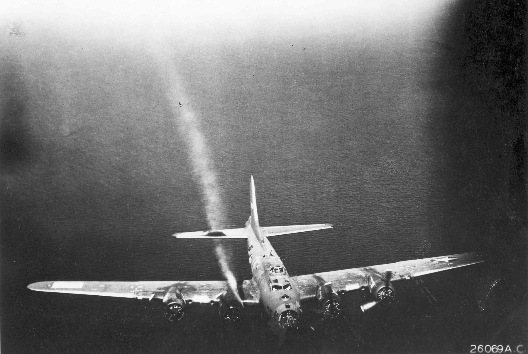 B-17F of the 95th Bomb Group with damage to the No. 3 engine continues to fly..jpg