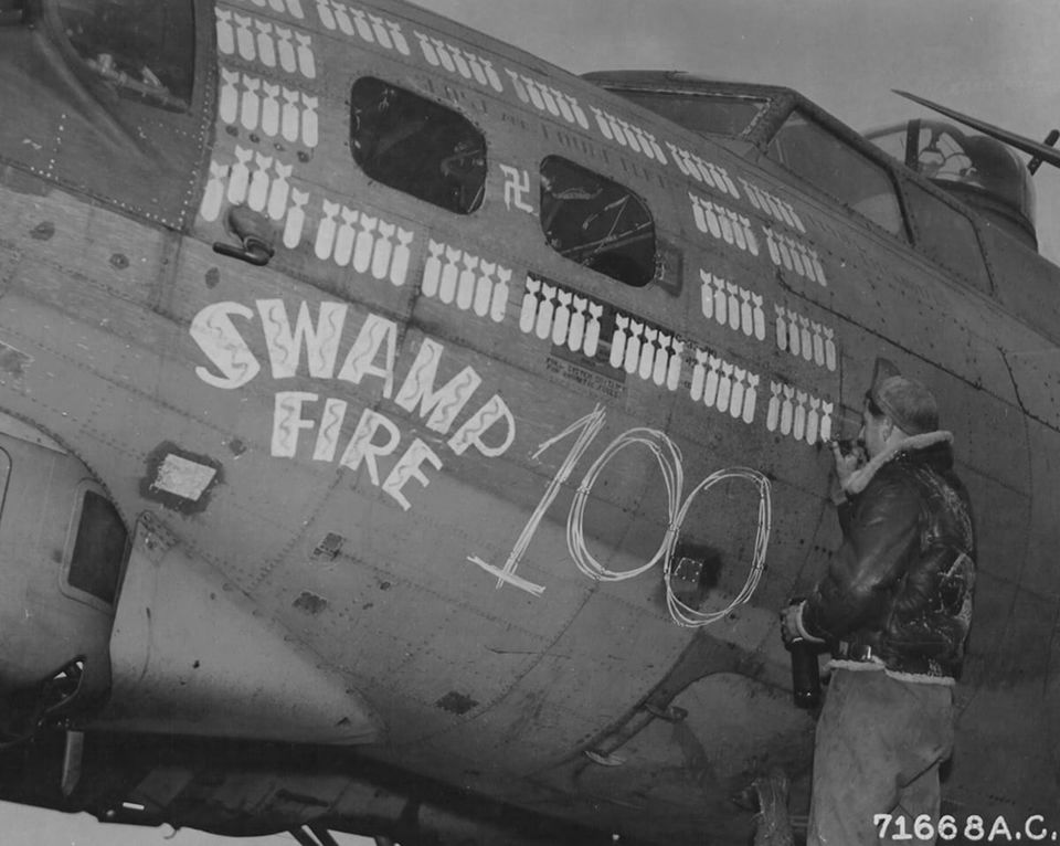 B17 42-32024 'Swamp Fire', 524th Bomb Squadron, 379th Bomb Group, has its 100th mission 'bomb'...jpg