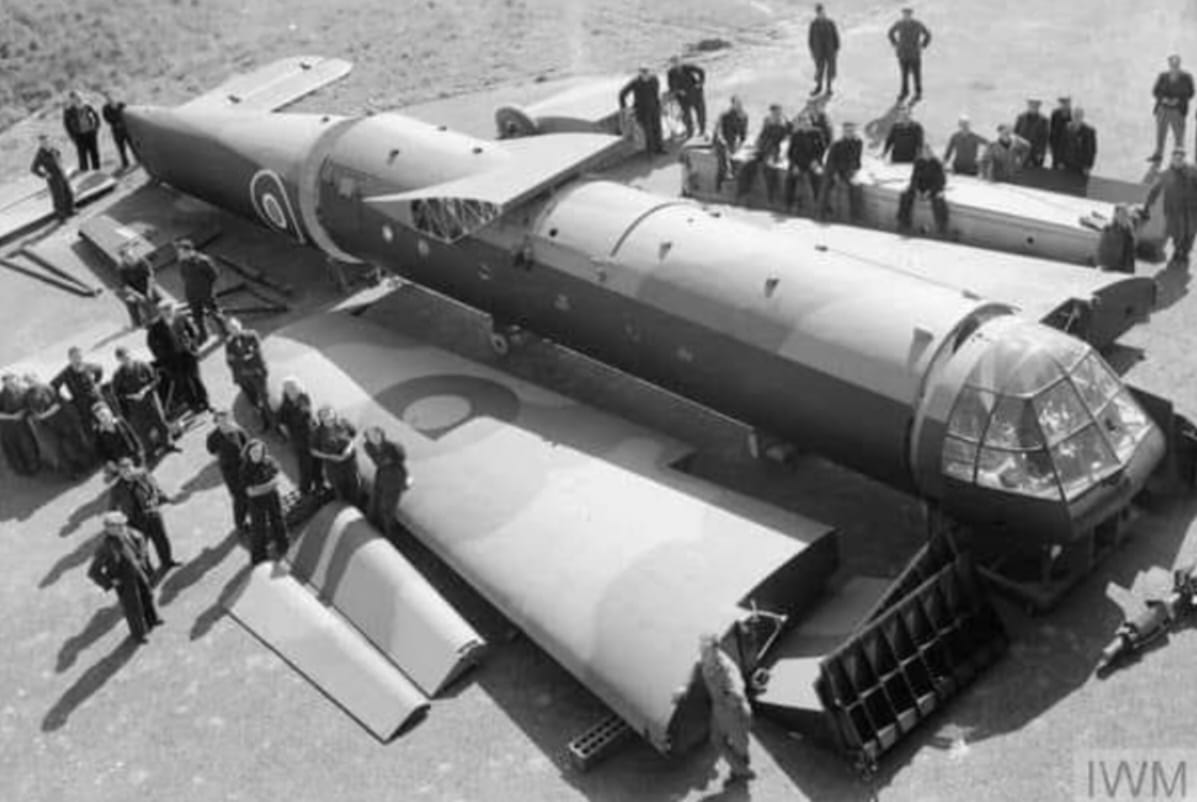 Civilian workers pose with sections of an Airspeed Horsa glider, as received from the manufact...jpg