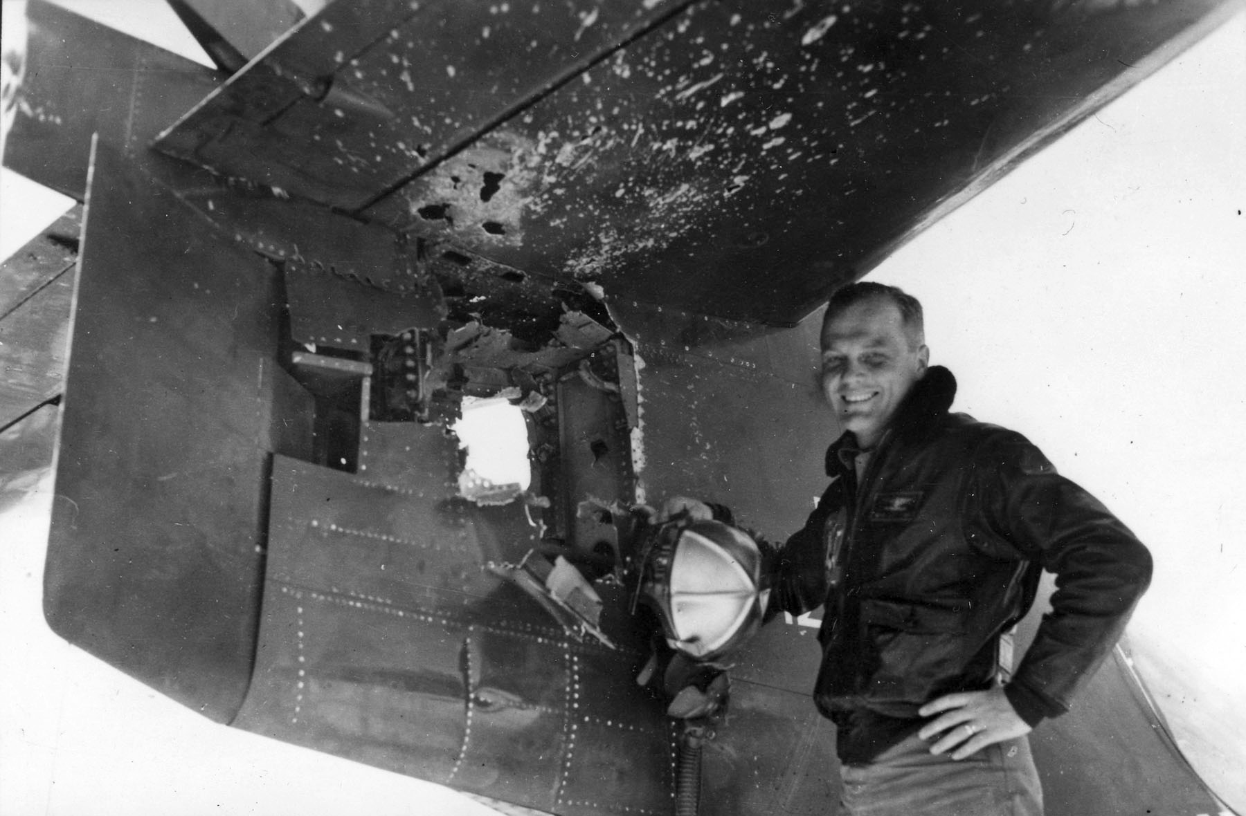 GLENN-John-H.-Glenn-Jr.-Major-USMC-with-a-few-of-the-714-holes-in-his-Grumman-F9F-Panther.jpg