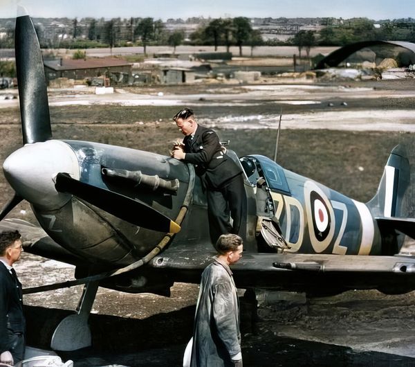 Groundcrew refuel Supermarine Spitfire Mark VB, 'ZD-Z', of No.222 Squadron RAF, from a tractor...jpg