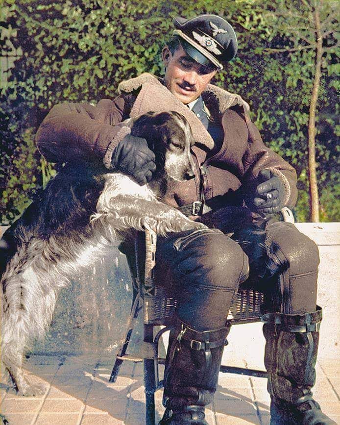 GruppenkommandeurOberst Adolf Galland relaxes with the squadron pet dog.jpg