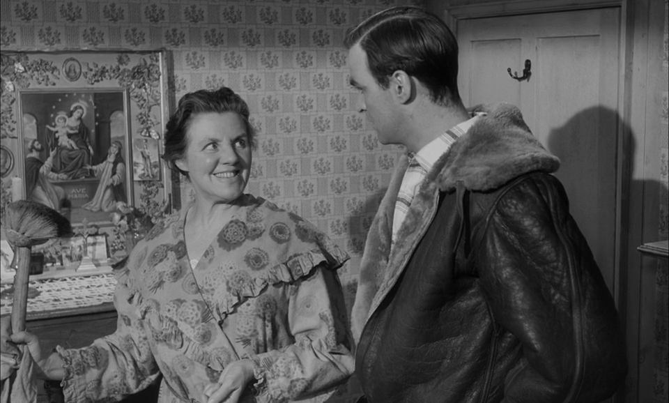 Marjorie Rhodes as Ma West, landlady & Stanley Baker - Hell Drivers (1957).png