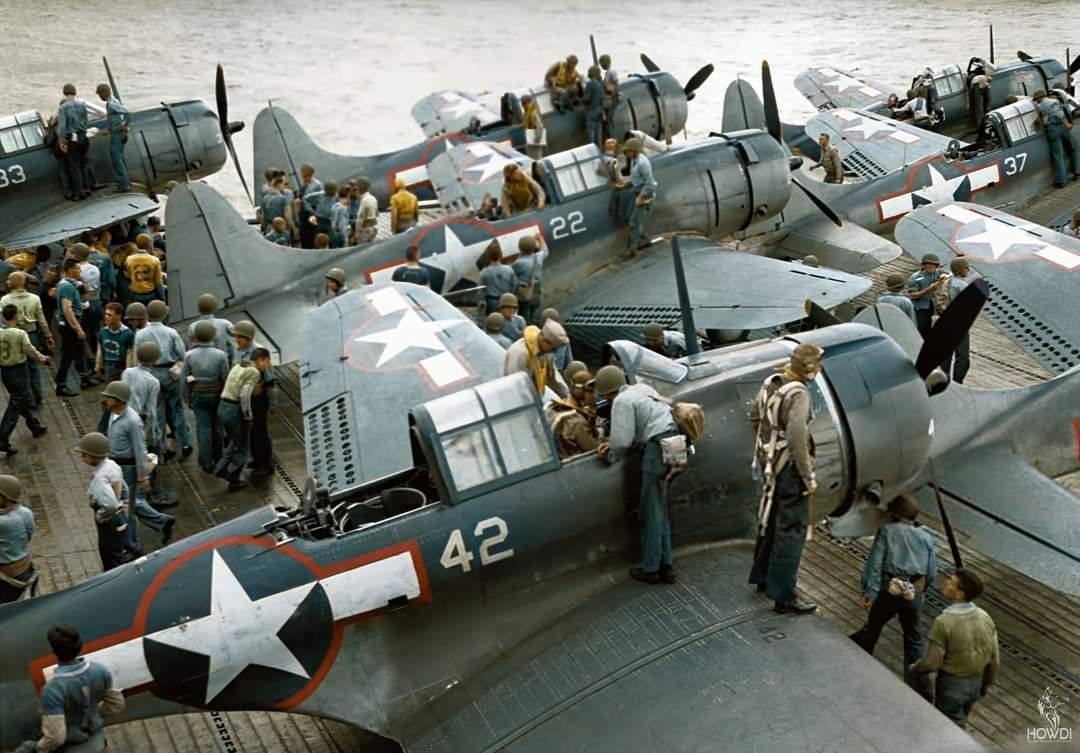 Pilots clamber IN the cockpits of their Douglas Dauntless.jpg