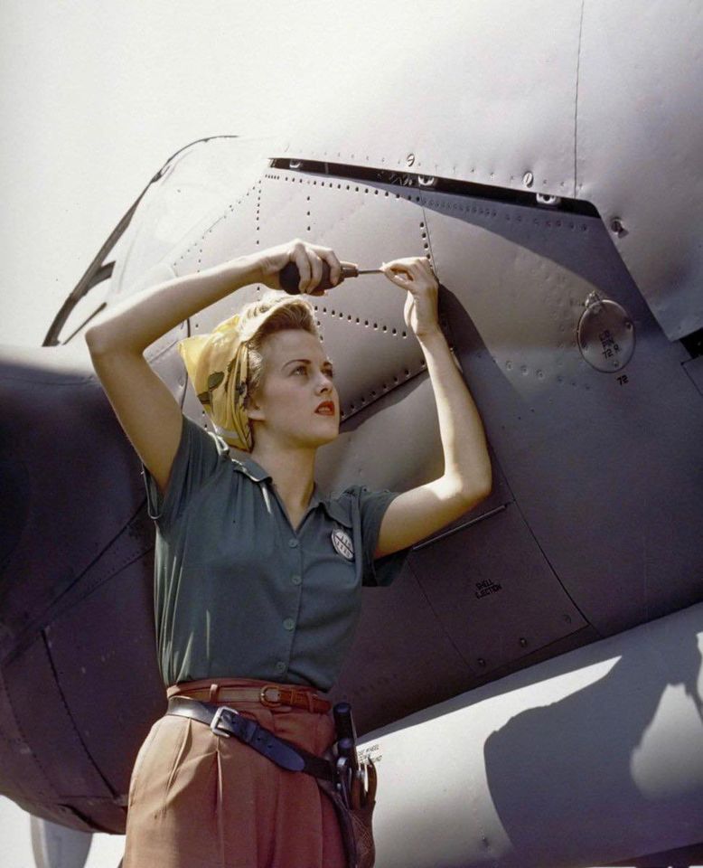 Sally Wadsworth works on the fuselage of a P-38.jpg