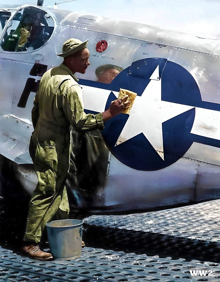 SSGT. William Accoo washes his Mustang with soap and water, and soon after he waxes the Mustang.jpg