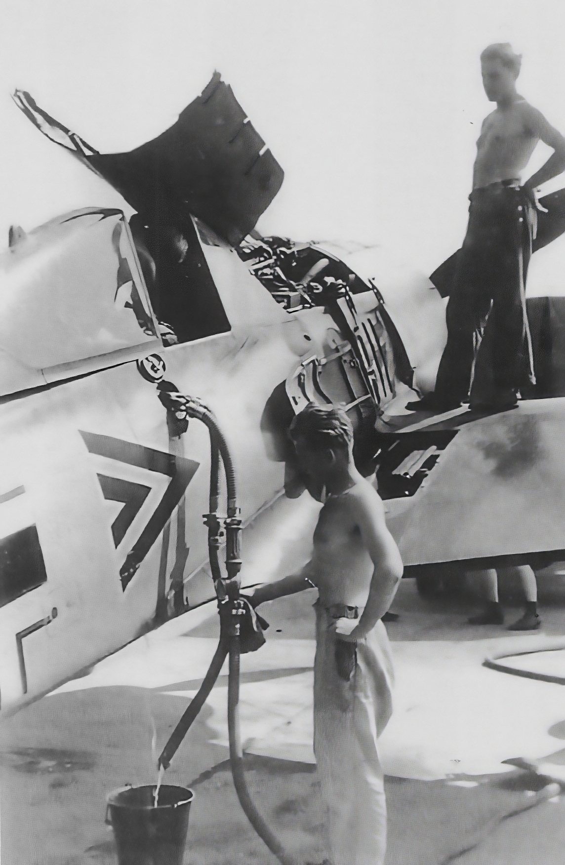 The refueling of a Luftwaffe Focke-Wulf Fw.190A-4 fighter from the headquarters unit of JG26. ...jpg