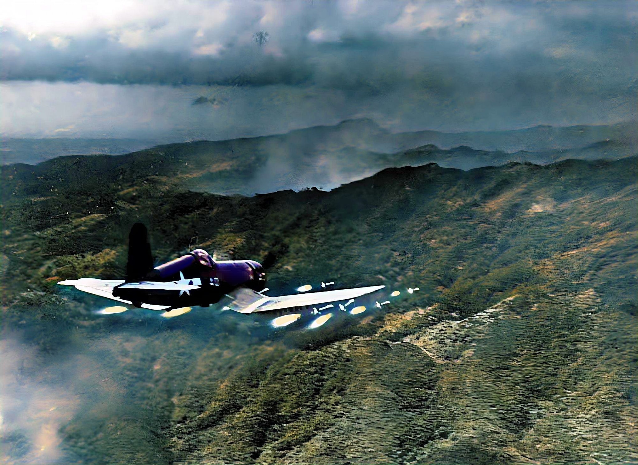 US Marine Corsair firing it's rockets at a Japanese position on Okinawa.jpg