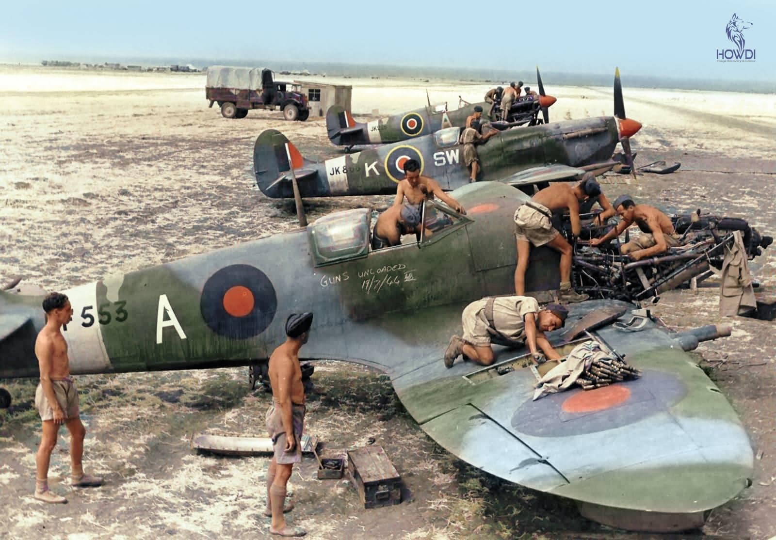 War weathered Spitfire Mk Vs of RAF 253 and 32 Squadron, being serviced in Italy 1944..jpg